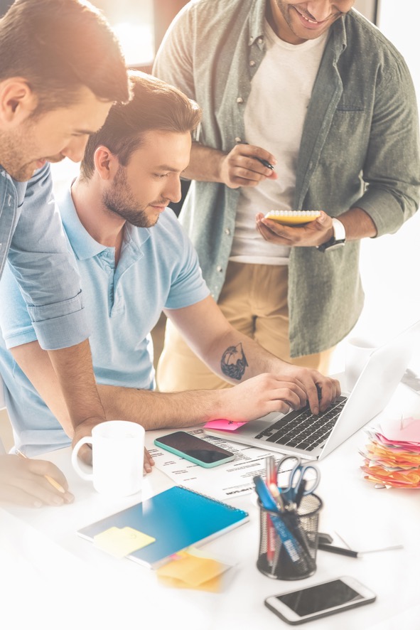 cropped-shot-of-cheerful-young-businessmen-using-l-2023-11-27-05-05-27-utc_591x886